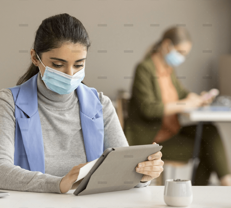 demo-attachment-192-employee-disinfecting-electronic-device